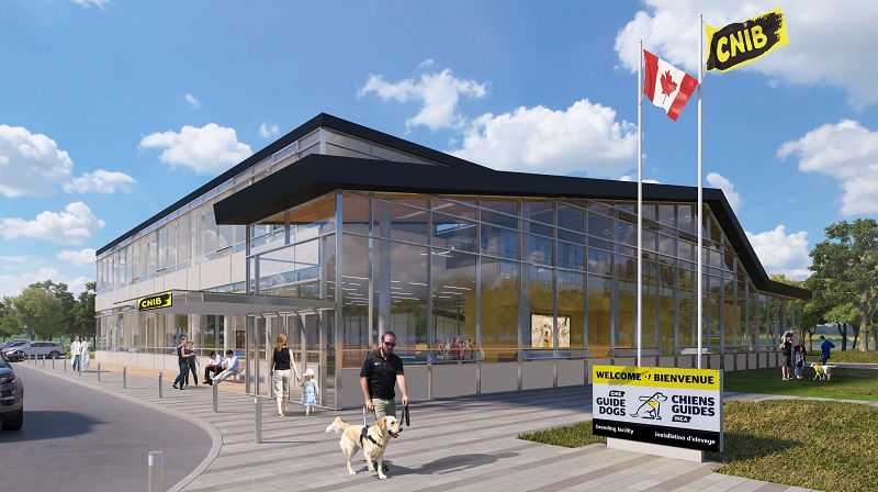 View of the outside of the facility, showing the Canadian and CNIB flags, and the glassed in entrance