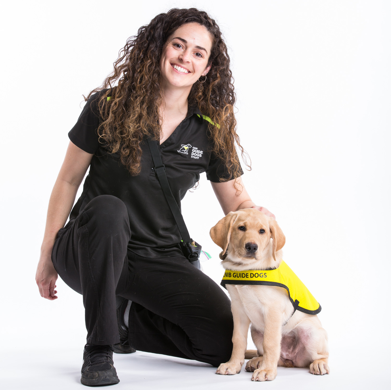 CNIB Guide Dogs trainer with puppy in training