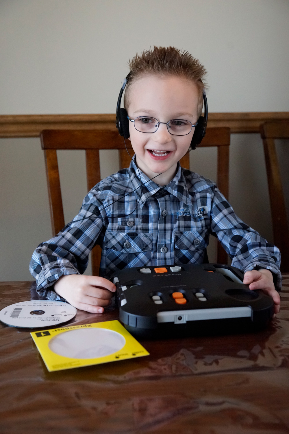 Young boy listening to audio book
