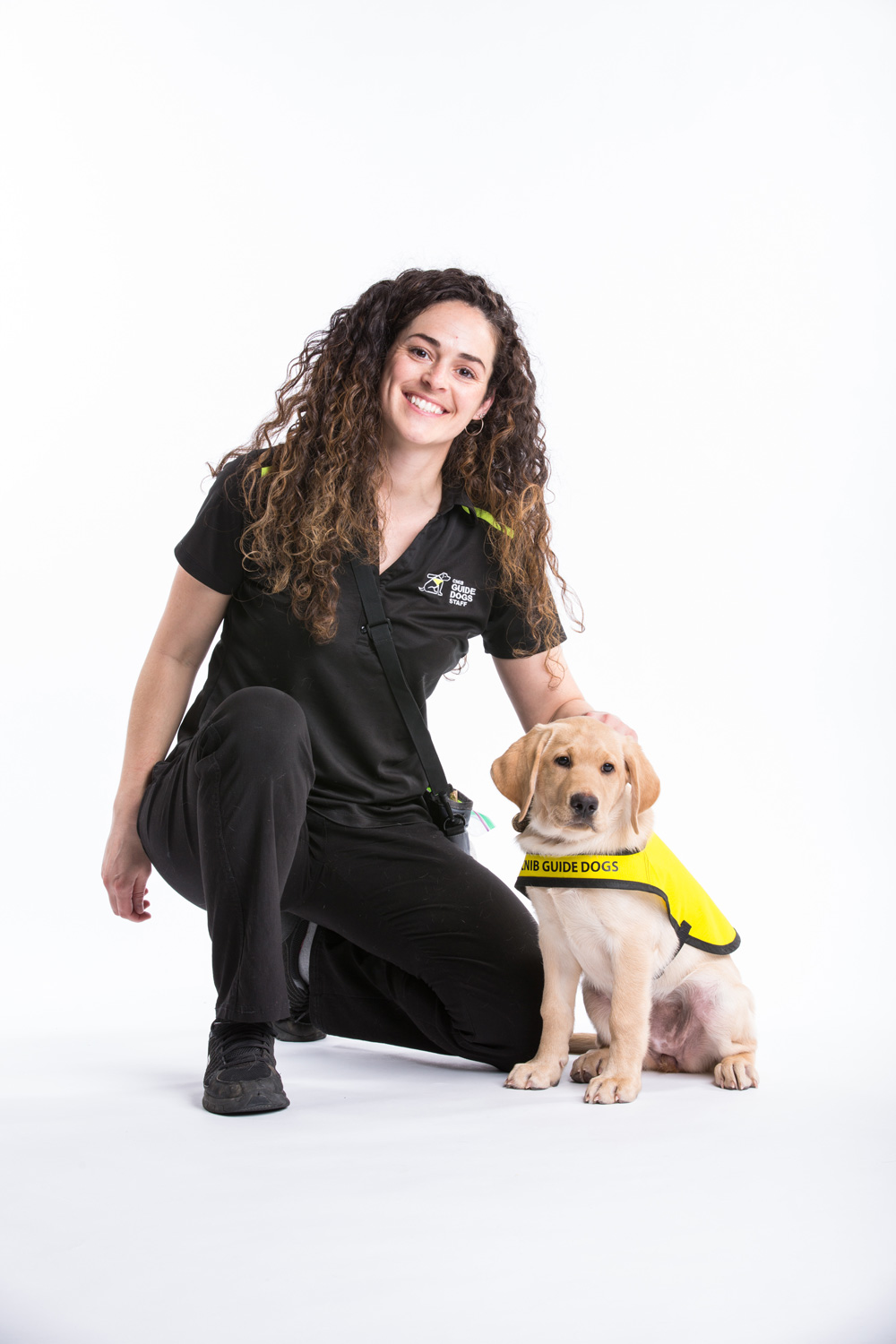 CNIB Guide Dogs trainer with puppy in training 