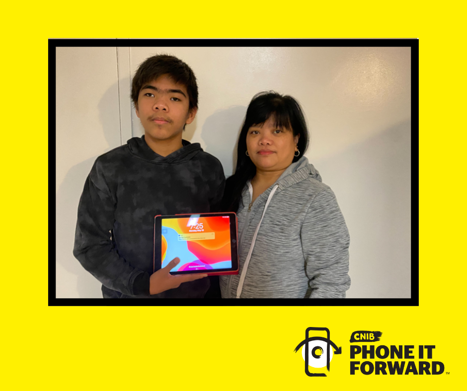 [Image description: John (left) and Mary (right) stand side by side. John is holding his iPad. On a Yellow background with a picture frame outline. Phone it Forward logo bottom-right corner.]