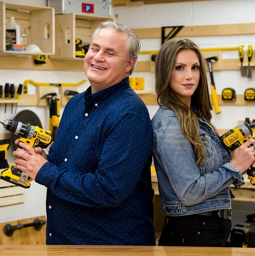 The hosts of Eyes for the Job stand back to back holding power drills 