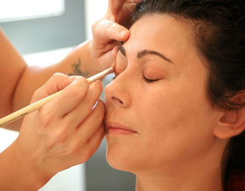 Woman having her makeup done