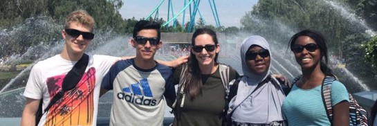 Five youth post at Canada's Wonderland in front of water fountains
