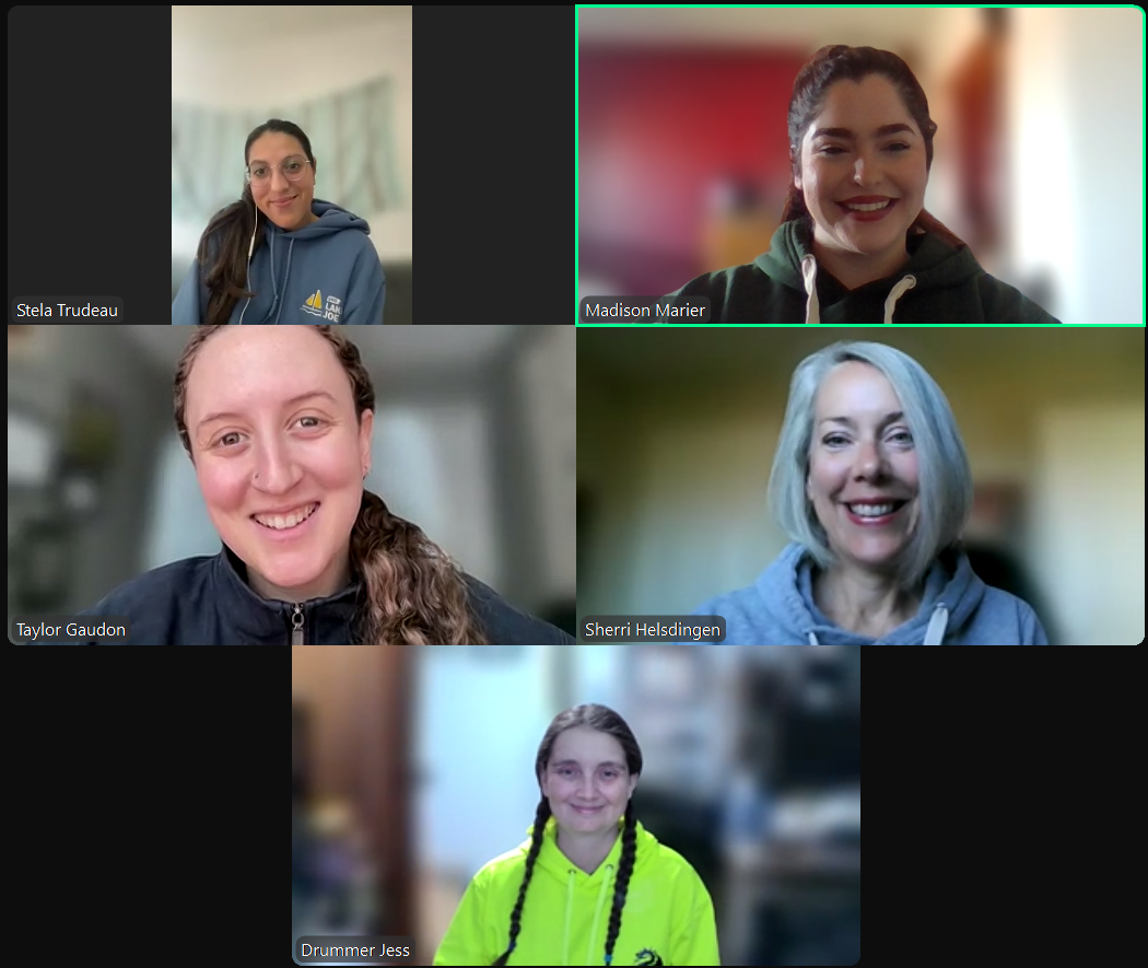 Photo of five women on a Zoom screen smiling at the camera