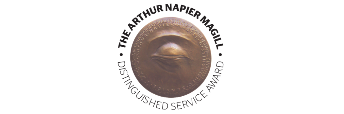 The Arthur Napier Magill Distinguished Service Award. A tactile bronze medallion with a sculpted design of a closed eye.