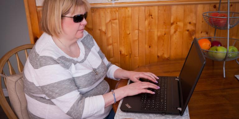 Woman using a computer with screen reader