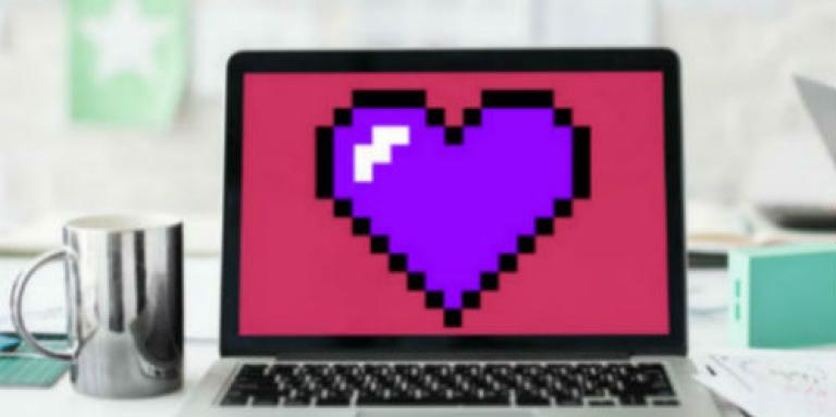 Laptop computer with a large purple heart on the screen 