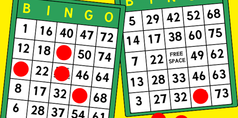 An illustration of a bingo card with numbers and red playing chips. 