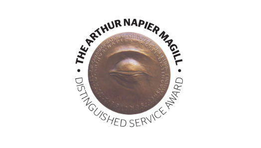 The Arthur Napier Magill Distinguished Service Award. A tactile bronze medallion with a sculpted design of a closed eye.